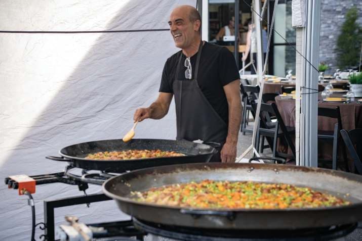 Chef stirring paella
