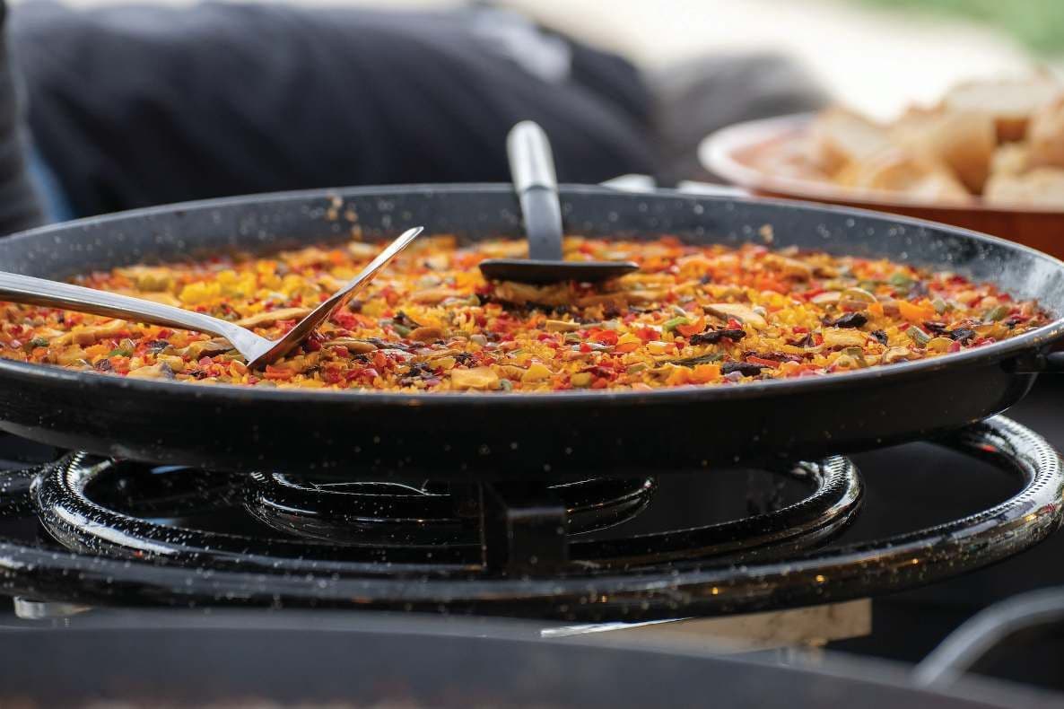 Paella cooking in a giant pan